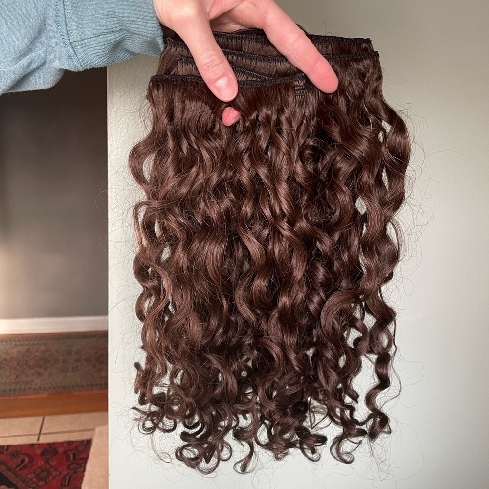 Never worn- 16” 110g curly Bebonia extensions in Dark brown